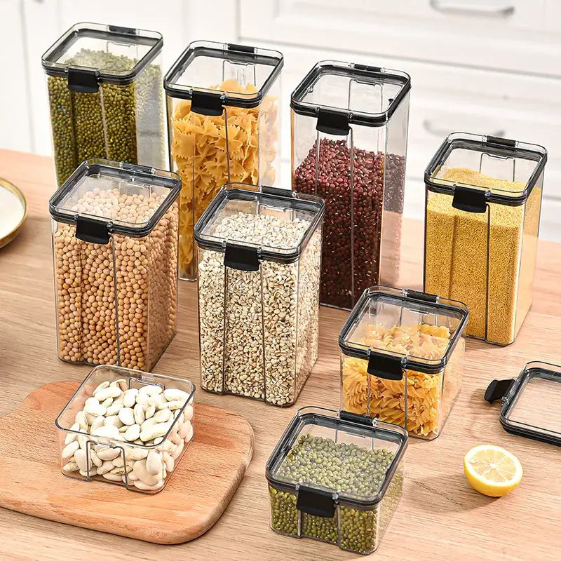 Sealed Kitchen Storage Jars Set displaying various sizes filled with grains and pasta on a wooden countertop.