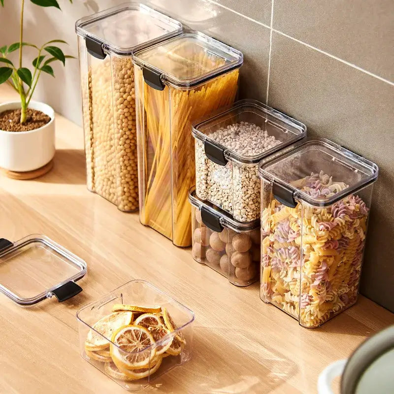 Sealed Kitchen Storage Jars Set arranged on a kitchen countertop, showcasing various sizes filled with different foods.